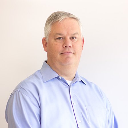 Headshot of Andrew Schulz.