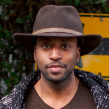 Headshot of Ade Adenji.