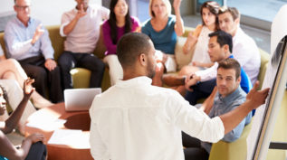 boardroom meeting with a large group of people