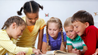 a group of children reads together