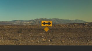 Arrow pointing both directions in desert