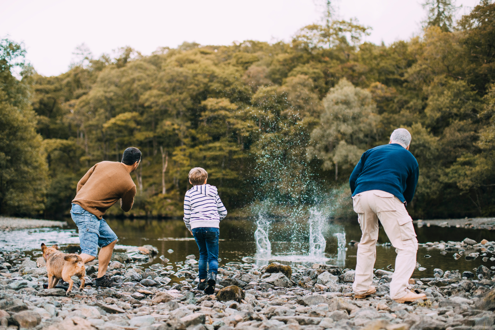 A family working together on family philanthropy while skipping stones