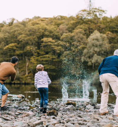 A family working together on family philanthropy while skipping stones