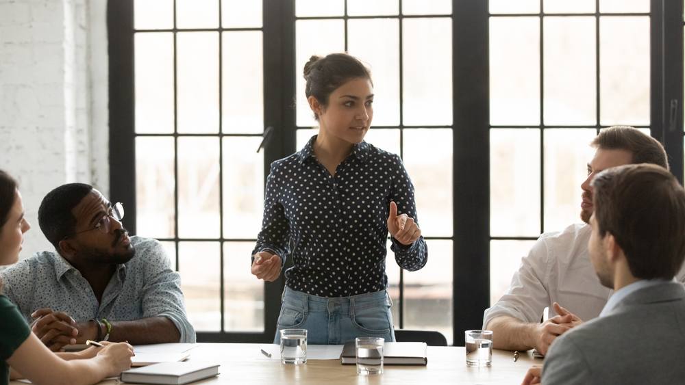 A woman speaking up in a family meeting