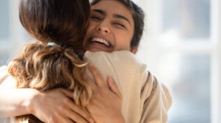 Two women hugging. Conflict repair