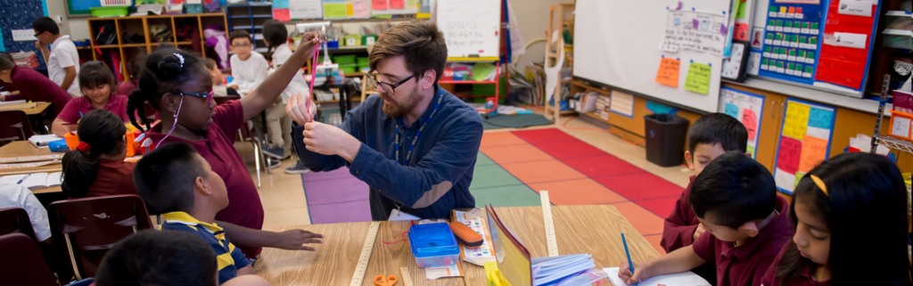 Children playing with teacher in classroom, Courtesy of the Rogers Family Foundation