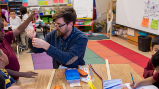 Children playing with teacher in classroom, Courtesy of the Rogers Family Foundation